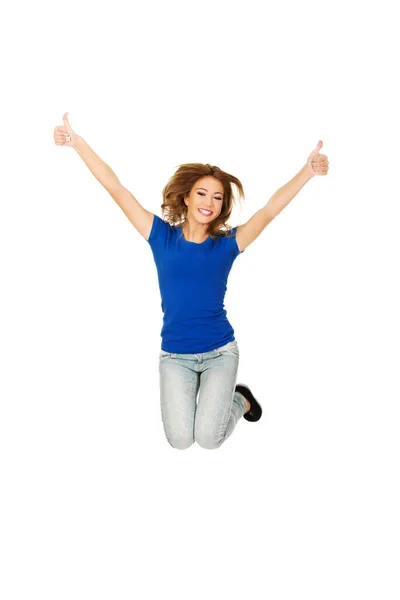 Woman  jumping with thumbs up — Stock Photo, Image