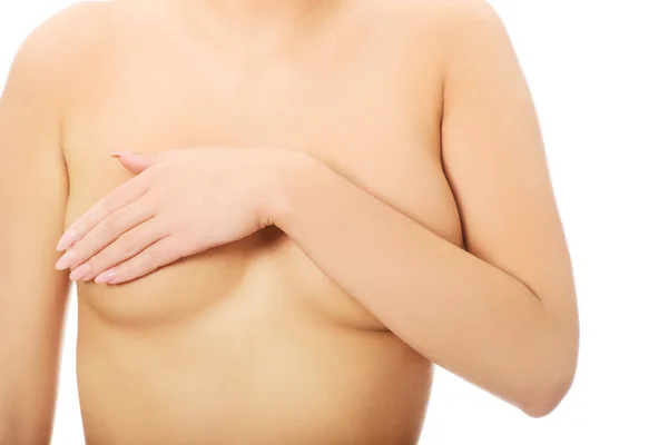 Woman covering her breast. — Stock Photo, Image