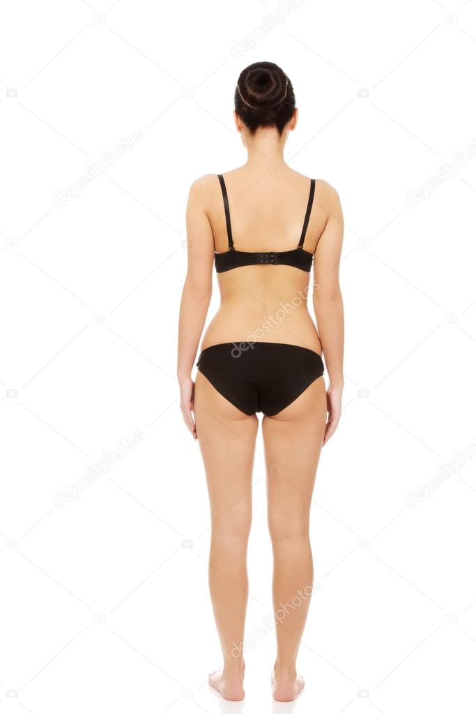 Woman standing in underwear.