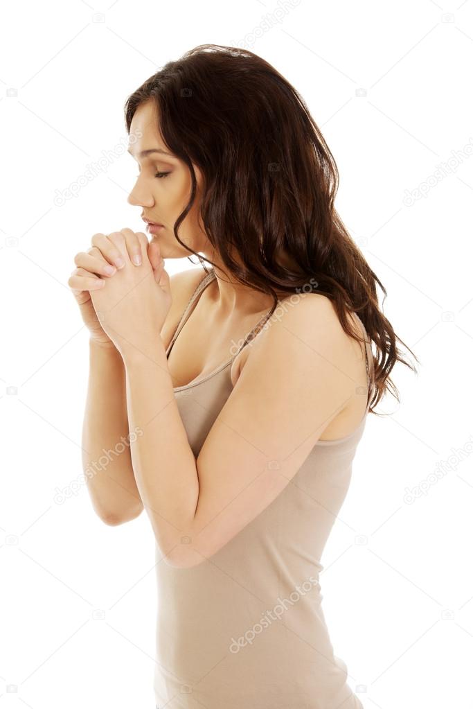 Woman praying with her hands