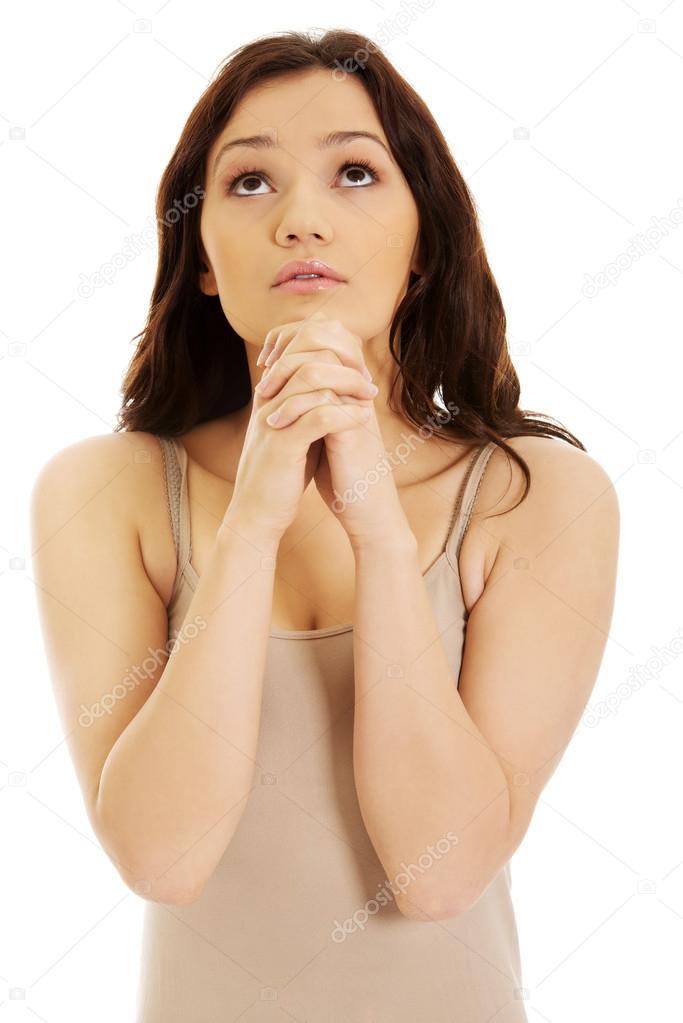 Woman praying with her hands
