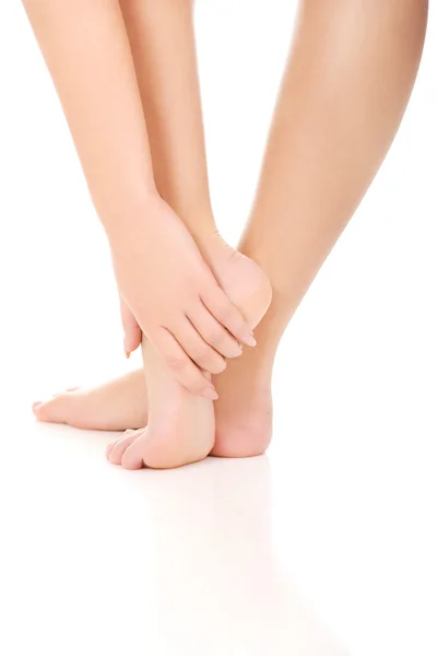 Woman touching her feet. — Stock Photo, Image