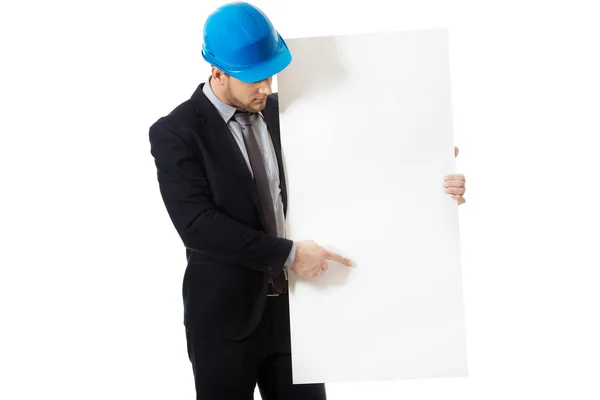Businessman enginner showing empty banner. — Stock Photo, Image