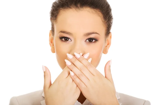 Businesswoman covering mouth with hands. — Stock Photo, Image