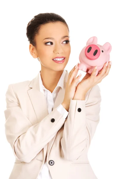 Business woman with a piggybank. — Stock Photo, Image