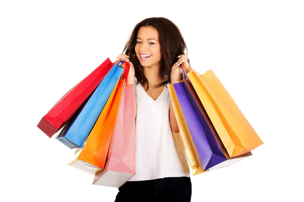 Mulher sorridente com sacos de compras. — Fotografia de Stock