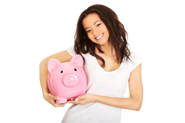 Mujer sostiene a Piggybank . —  Fotos de Stock