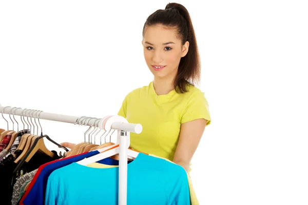 Happy woman thinking what to dress. — Stock Photo, Image