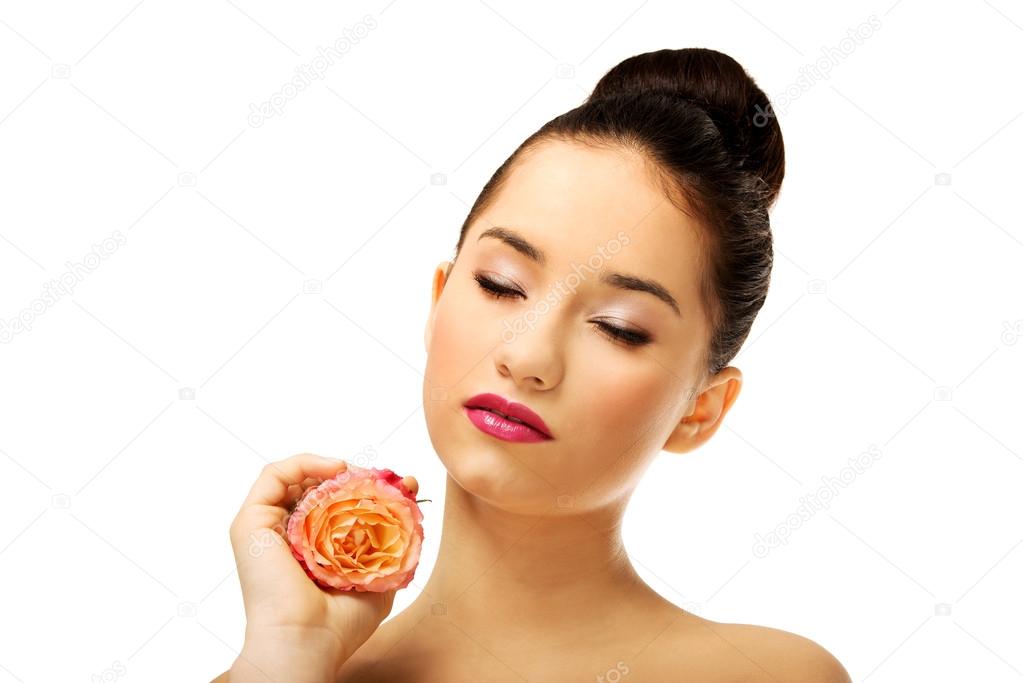 Beautiful woman with pink rose.