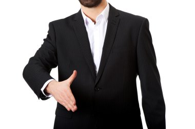 Businessman offering a handshake.