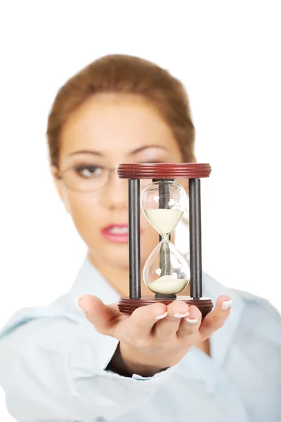 Young businesswoman with hourglass. — Stock Photo, Image