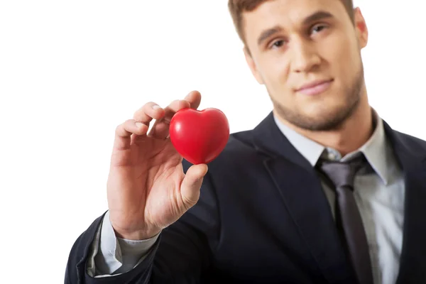 Geschäftsmann mit Herzmodell. — Stockfoto