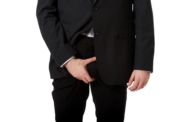 Young businessman feeling pain in his crotch. — Stock Photo, Image