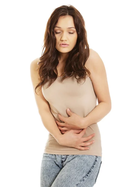 Woman suffering from severe pain in her tummy. — Stock Photo, Image