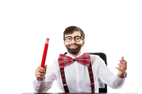 Young old fashioned man with big pencil. — Stock Photo, Image