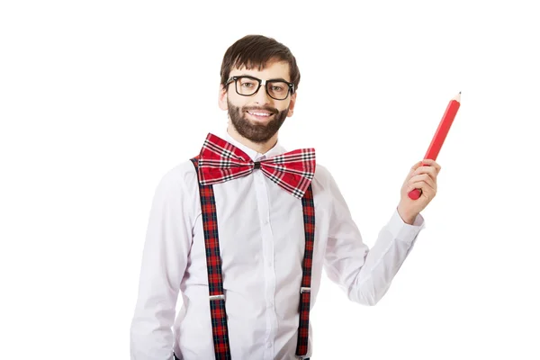 Old fashioned man pointing up with big pencil. — Stock Photo, Image