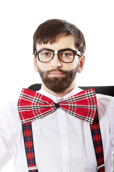 Young old fashioned man sitting on armchair. — Stock Photo, Image