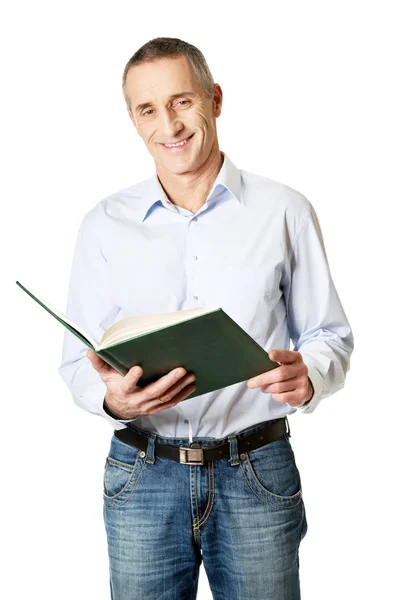 Handsome man reading his schedule — Stock Photo, Image