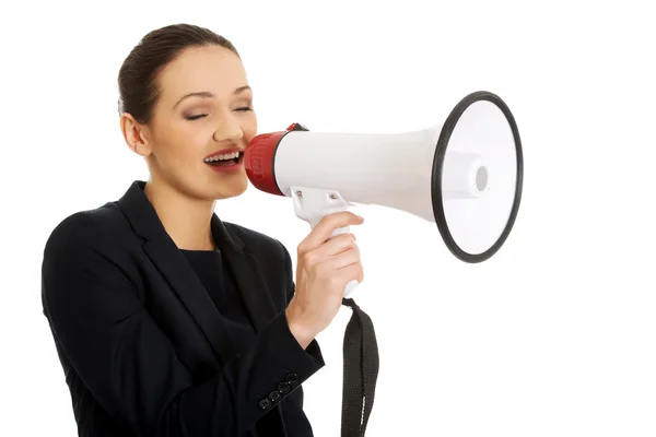 Podnikatelka křičí přes megafon. — Stock fotografie