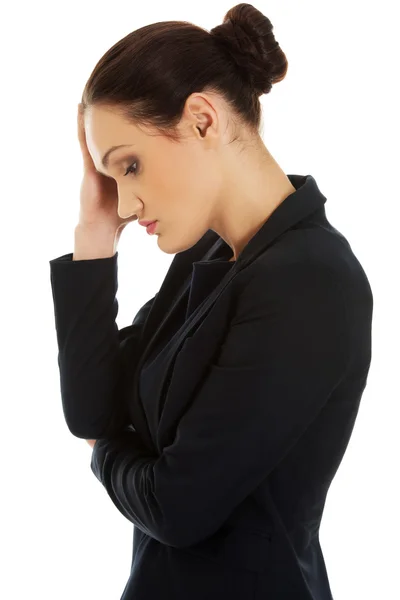 Tired businesswoman touching her head. — Stock Photo, Image