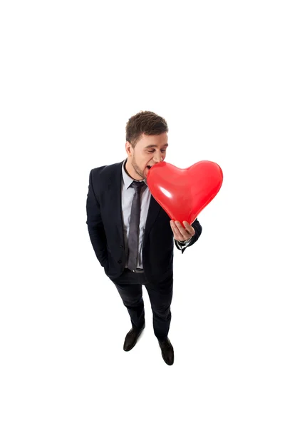 Zakenman met hartvormige ballon. — Stockfoto
