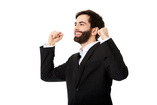 Businessman making fists in a winner gesture. — Stock Photo, Image