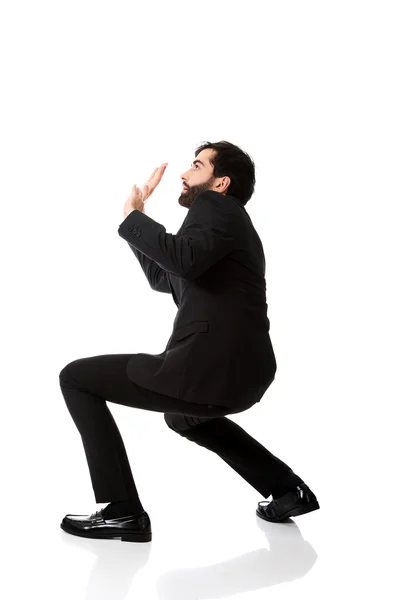 Empresario tratando de protegerse . — Foto de Stock