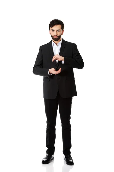 Businessman showing the size with hands. — Stock Photo, Image