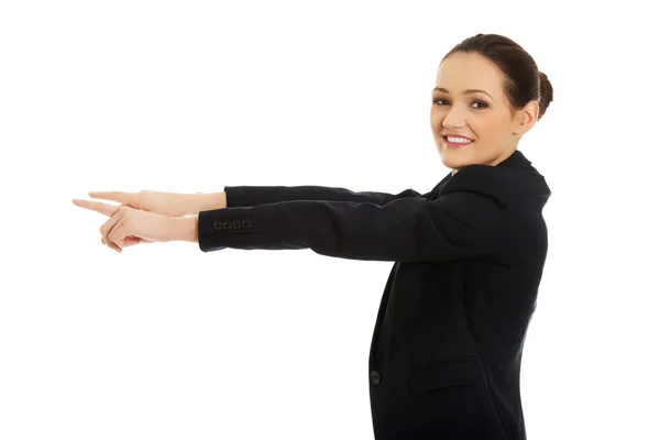 Businesswoman pointing on empty space. Royalty Free Stock Photos