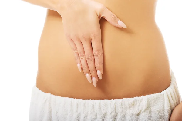 Mulher massageando barriga magro — Fotografia de Stock
