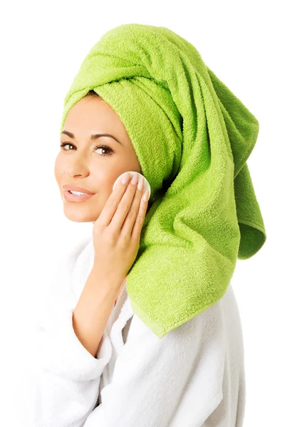 Woman in bathrobe removing makeup — Stock Photo, Image