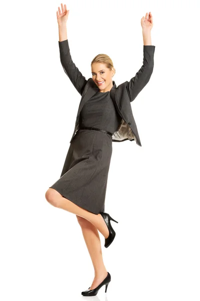 Cheerful businesswoman with arms up — Stock Photo, Image