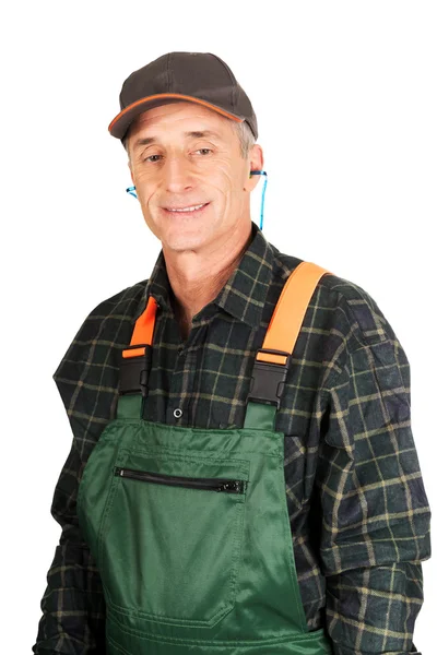 Mature worker wearing ear protectors — Stock Photo, Image