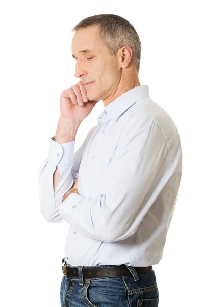 Side view pensive man touching chin — Stock Photo, Image