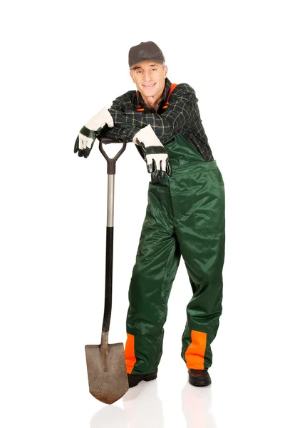 Mature gardener with a spade — Stock Photo, Image