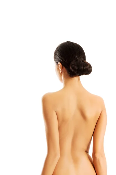 Vue arrière de la femme mince seins nus — Photo