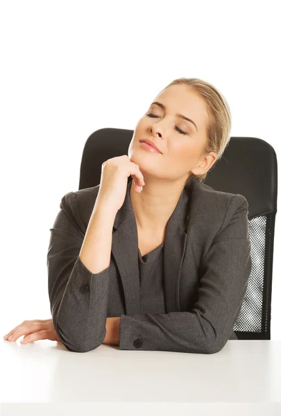 Businesswoman with hand on chin — Stock Photo, Image