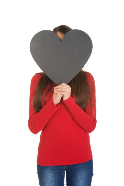 Woman hiding behind heart paper — Stock Photo, Image