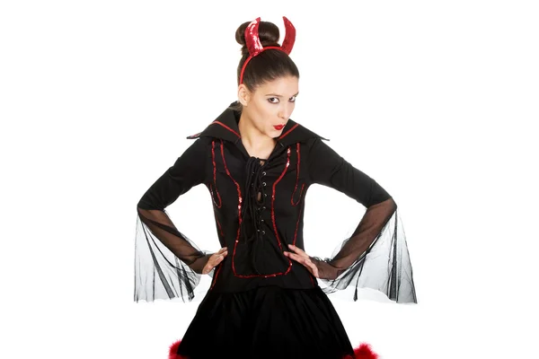 Vrouw in duivel carnaval kostuum. Stockfoto