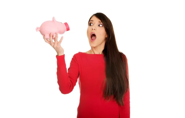 Shocked woman with piggybank. — Stock Photo, Image