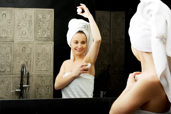 Woman using deodorant. — Stock Photo, Image