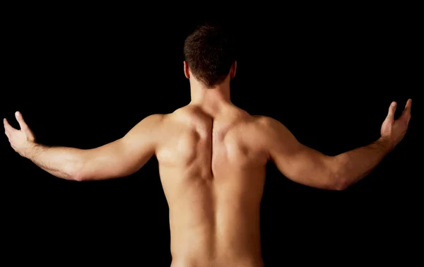 Sexy man showing his muscular back. — Stock Photo, Image