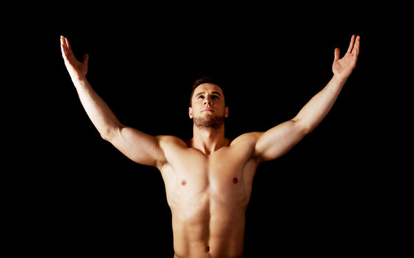 Sexy muscular man with hands up.