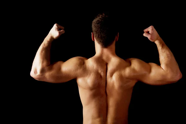 Sexy man showing his muscular back. — Stock Photo, Image