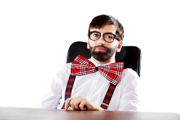 Old fashioned man sitting by a desk. — Stock Photo, Image