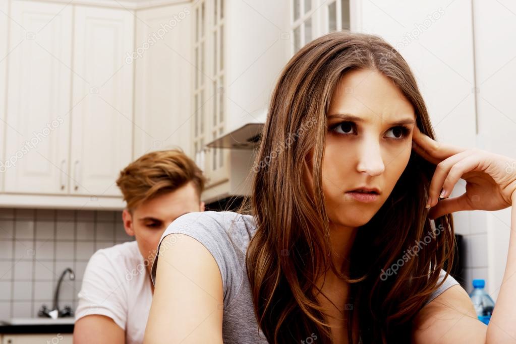 Couple having an argument in the kitchen.