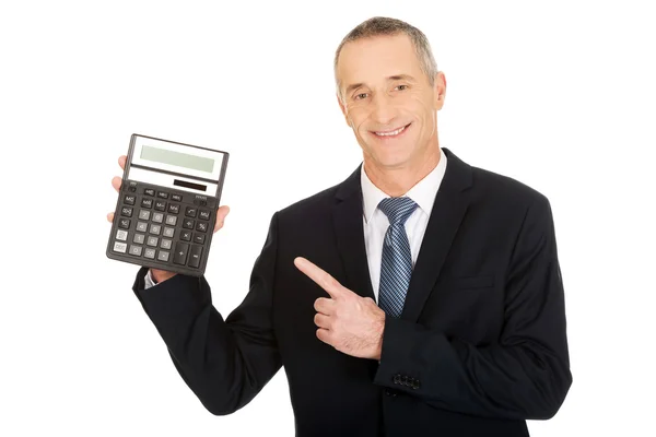 Businessman pointing on calculator — Stock Photo, Image