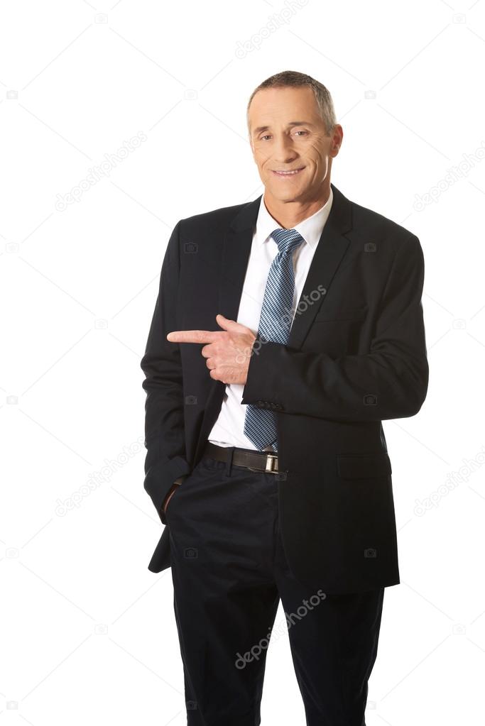 Businessman pointing to the left