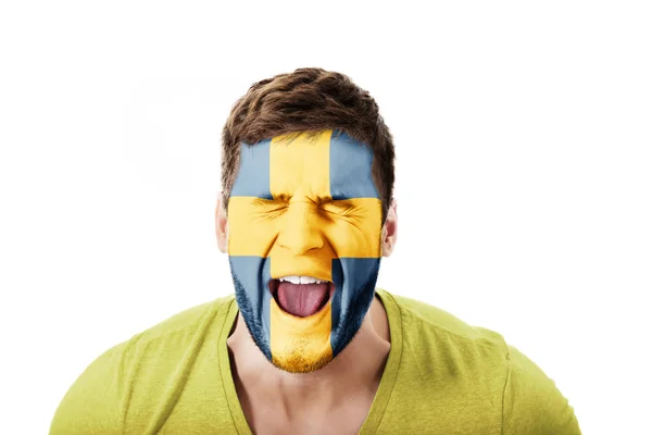 Skrek mannen med Svenska flaggan på ansikte. — Stockfoto