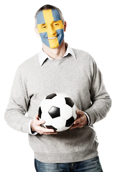 成熟的男人，与瑞典国旗的脸上. — 图库照片